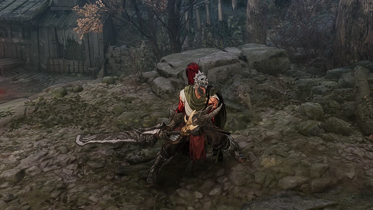 Khazan wearing green armor holding a mean looking two handed greatsword