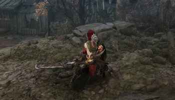 Khazan wearing green armor holding a mean looking two handed greatsword