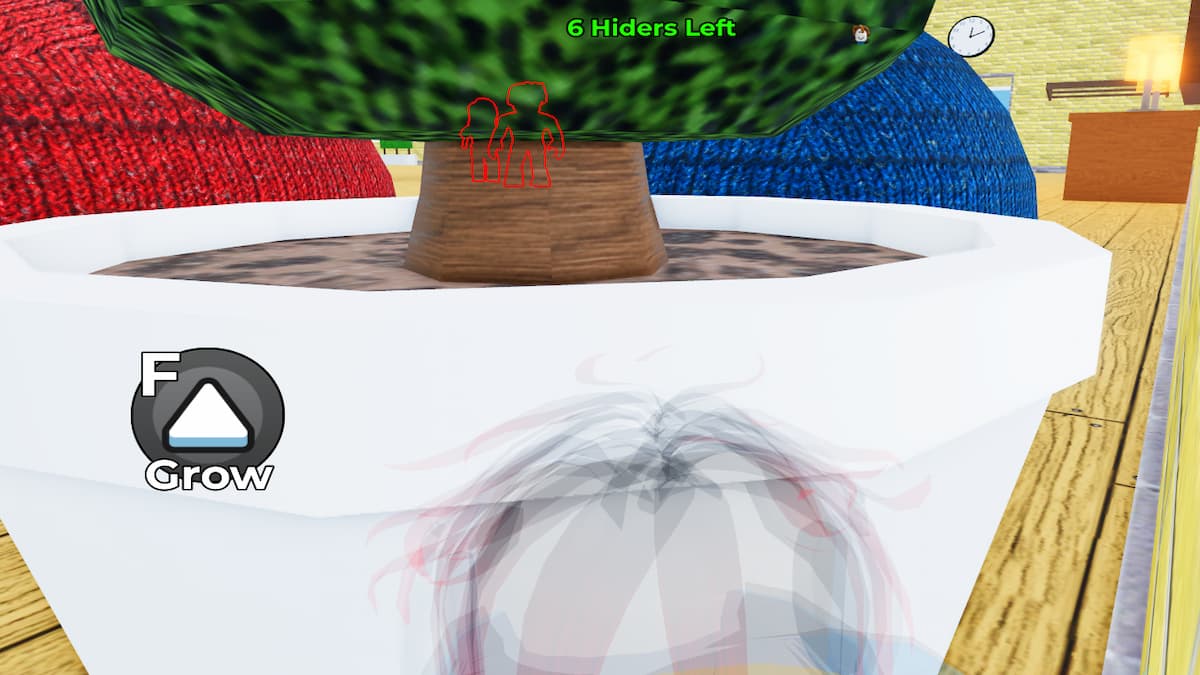 A player hiding behind a pot